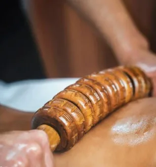 What's Actually Going On When Someone Runs Carved Wood Over Your Skin