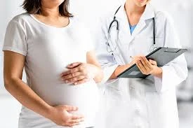 When should teenage girls have their first gynecologist visit?