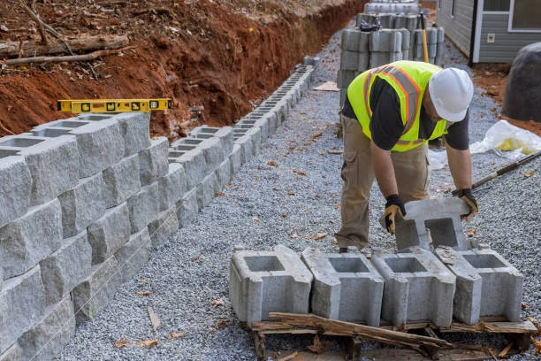 Why You Should Hire Professional Retaining Wall Contractors for Sloped Yards